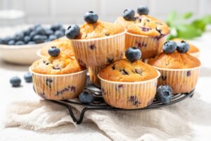 Healthy vegan banana blueberry muffins with fresh berries