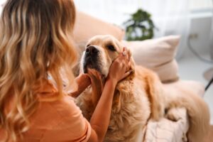 woman petting her dog